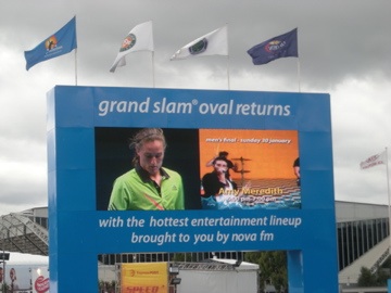 grand slam oval sign with flags