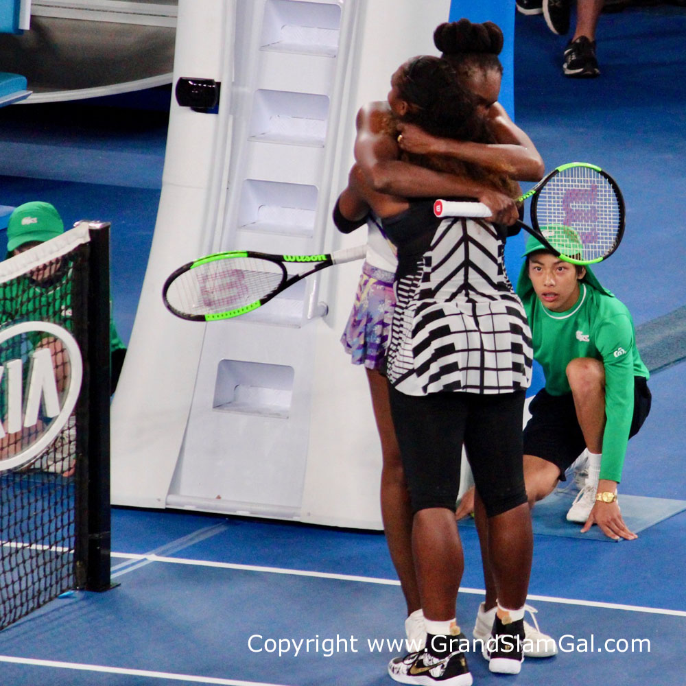 Serena and Venus hugging at the end of the match